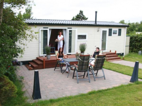 Comfortable chalet in a holiday park, directly situated by the Waddenzee